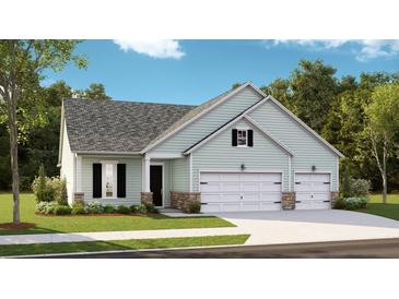 Charming single-story home with light green siding, stone accents, well-manicured lawn and two car garage at 1730 Locals St, Summerville, SC 29485