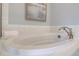 Oval freestanding bathtub with modern fixtures and white subway tile at 173 Fiddleback Dr, Summerville, SC 29486