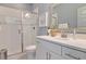 Modern bathroom with a walk-in shower and white cabinets at 173 Fiddleback Dr, Summerville, SC 29486