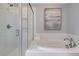 Bathroom with a walk-in shower, soaking tub, and white subway tile at 173 Fiddleback Dr, Summerville, SC 29486