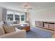 Spacious bonus room with sectional sofa, wood accent wall, hardwood floors at 173 Fiddleback Dr, Summerville, SC 29486