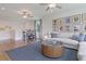 Bonus room with sectional sofa, a small table, and hardwood floors at 173 Fiddleback Dr, Summerville, SC 29486
