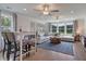Bright bonus room with sectional sofa, coffee table, and hardwood floors at 173 Fiddleback Dr, Summerville, SC 29486
