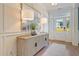 Entryway with wood floors, console table and lamps, and white door at 173 Fiddleback Dr, Summerville, SC 29486