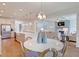 Open kitchen with large island and views into living room at 173 Fiddleback Dr, Summerville, SC 29486