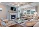 Living room with fireplace, coffered ceiling, and plenty of natural light at 173 Fiddleback Dr, Summerville, SC 29486
