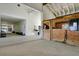 Bright horse barn aisle with white board and batten walls and horse stalls to the right at 130 Peninsula Dr, Ravenel, SC 29470