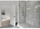 Modern bathroom features a luxurious glass shower and stylish gray hexagon tile floor at 1075 Capersview Ct, Awendaw, SC 29429