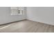 Neutral bedroom with light wood floors and bright natural light at 1075 Capersview Ct, Awendaw, SC 29429