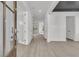 Inviting foyer with sleek floors, white walls, and plenty of natural light at 1075 Capersview Ct, Awendaw, SC 29429