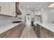 Modern kitchen with two-tone cabinetry, a large island, and a stainless steel dishwasher at 1075 Capersview Ct, Awendaw, SC 29429