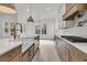 Modern kitchen with a large island, stainless steel appliances, and lots of cabinet space at 1075 Capersview Ct, Awendaw, SC 29429