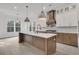 Contemporary kitchen with a center island, modern lighting, and stainless steel appliances at 1075 Capersview Ct, Awendaw, SC 29429
