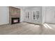 Spacious living room featuring a striking brick fireplace and large windows at 1075 Capersview Ct, Awendaw, SC 29429