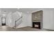 Cozy living space with modern fireplace, staircase, and open layout at 1075 Capersview Ct, Awendaw, SC 29429