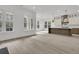 Open living space features a modern kitchen, dining area, and lots of natural light at 1075 Capersview Ct, Awendaw, SC 29429