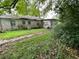 Backyard of house showing overgrown vegetation at 1908 Savage Rd, Charleston, SC 29407