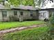 Backyard of house showing overgrown vegetation at 1908 Savage Rd, Charleston, SC 29407