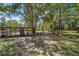 Horse stable with covered area and red buckets at 175 Maria Stuart Ln, Varnville, SC 29944