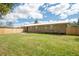Brick home with a large backyard and wooden fence at 175 Maria Stuart Ln, Varnville, SC 29944