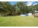 Large backyard with above ground pool, shed, and picnic table at 175 Maria Stuart Ln, Varnville, SC 29944