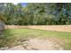Large backyard with a wooden privacy fence at 175 Maria Stuart Ln, Varnville, SC 29944
