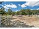 Spacious paddock with white fencing and a hay feeder at 175 Maria Stuart Ln, Varnville, SC 29944