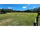 Spacious pasture with wooden fence and pond at 1501 Central Ave, Summerville, SC 29483