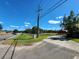 Roadside view of property with a barn, fence, and driveway at 1501 Central Ave, Summerville, SC 29483