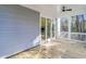 Covered porch with ceiling fan and view of the surrounding trees at 1619 Zurlo Way, Johns Island, SC 29455