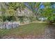 Landscaped backyard with seating area and mature trees at 190 Coming St, Charleston, SC 29403