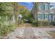 Brick driveway between two houses with lush greenery at 190 Coming St, Charleston, SC 29403