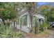 White house with green accents and lush landscaping at 190 Coming St, Charleston, SC 29403