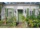 House entrance with green door and lush landscaping at 190 Coming St, Charleston, SC 29403