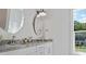 Elegant bathroom with double vanity, granite countertop, and large mirror at 507 Fiskdale Cir, Summerville, SC 29486