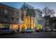 Charming street view showcasing historic buildings and parked cars along a tree-lined street at 29 Broad St # C, Charleston, SC 29401