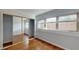 Bright bedroom with mirrored closet doors and wood flooring at 40 Bee St # 111, Charleston, SC 29403