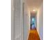 Long hallway with wood flooring and access to rooms at 40 Bee St # 111, Charleston, SC 29403