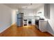 Modern kitchen with stainless steel appliances and wood flooring at 40 Bee St # 111, Charleston, SC 29403