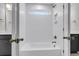 Bright bathroom showcasing a subway tiled shower with a bathtub and a window at 1153 Oak Bluff Ave, Charleston, SC 29492