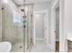 Modern bathroom features a glass shower with tile surround, and a view to a walk-in closet at 1153 Oak Bluff Ave, Charleston, SC 29492