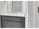 Bathroom vanity with a gray cabinet, white countertop, and gold fixtures at 1153 Oak Bluff Ave, Charleston, SC 29492