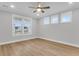 Well-lit bedroom featuring a modern ceiling fan and three large windows with blinds at 1153 Oak Bluff Ave, Charleston, SC 29492