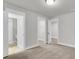 Spacious bedroom with carpet and views of an open closet and bathroom at 1153 Oak Bluff Ave, Charleston, SC 29492
