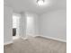 Cozy bedroom featuring plush carpeting and doors to the bathroom and hallway at 1153 Oak Bluff Ave, Charleston, SC 29492
