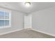 Bedroom featuring plush carpeting, a window, and a door leading to another room at 1153 Oak Bluff Ave, Charleston, SC 29492