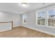 Upstairs bonus room with windows and a wood-look floor at 1153 Oak Bluff Ave, Charleston, SC 29492