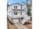 Beautiful two-story home with a large porch and a well-maintained yard at 1153 Oak Bluff Ave, Charleston, SC 29492
