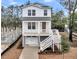 Charming two-story home with a raised foundation and a large front porch at 1153 Oak Bluff Ave, Charleston, SC 29492