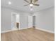 Spacious main bedroom with a ceiling fan and two doors leading to the bathroom and hallway at 1153 Oak Bluff Ave, Charleston, SC 29492